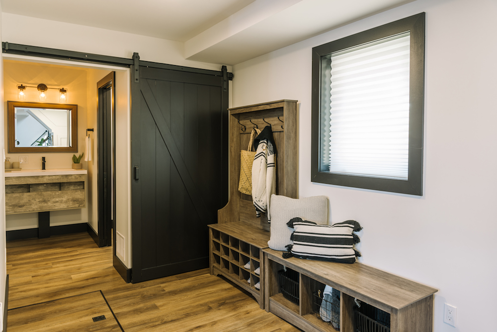 Mudroom with sliding barn door to washroom