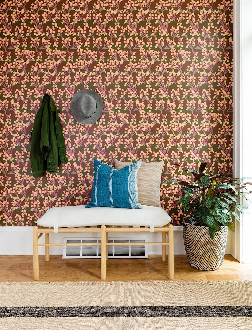 Wallpapered foyer with bench