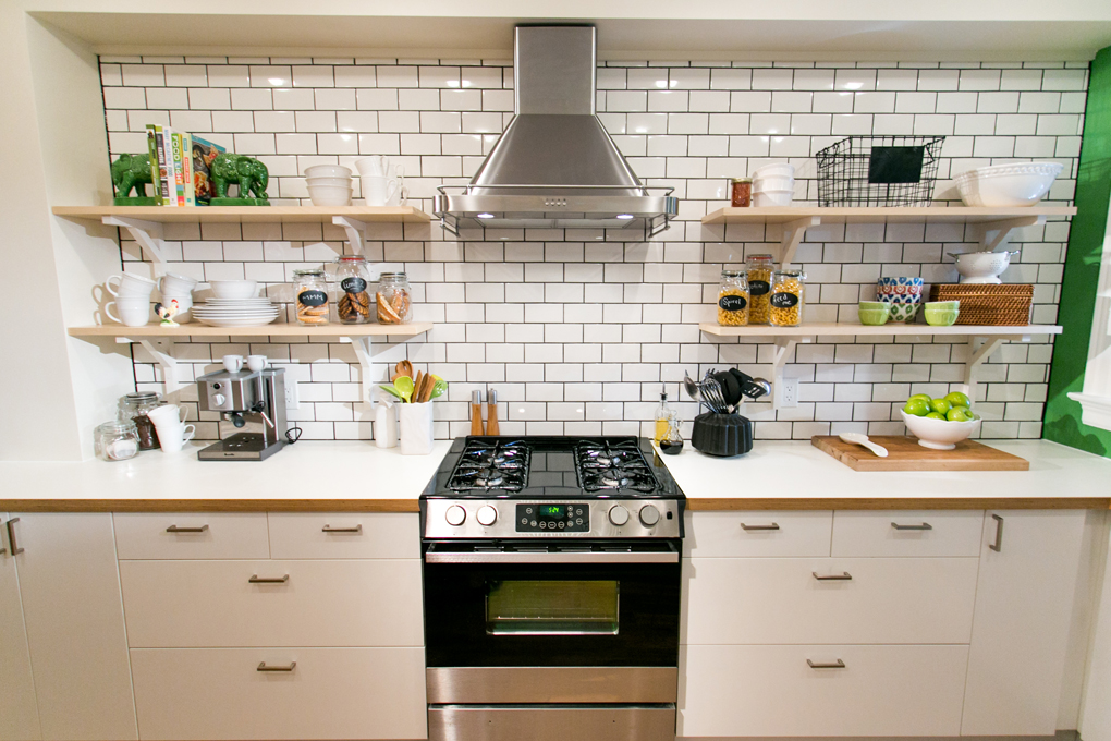 Modern white kitchen with bold hits of green