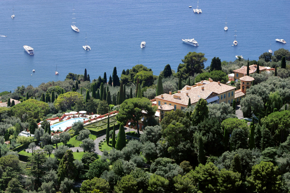 Built in the 1920s atop King Leopold II's villa, this home features a large stone staircase and eight bedroom suites