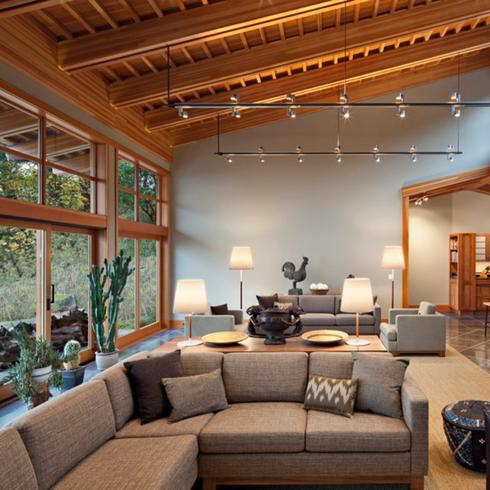 A cottage with wooden details on the ceiling