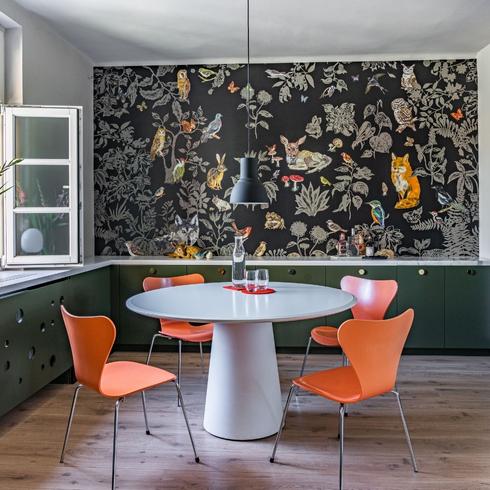 A breakfast nook with a graphic wallpaper design