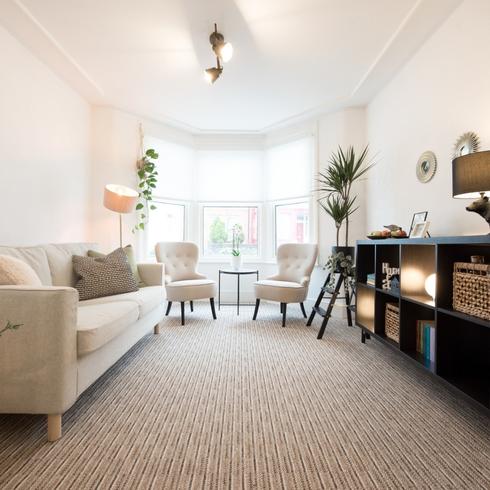 A spacious living room with carpet