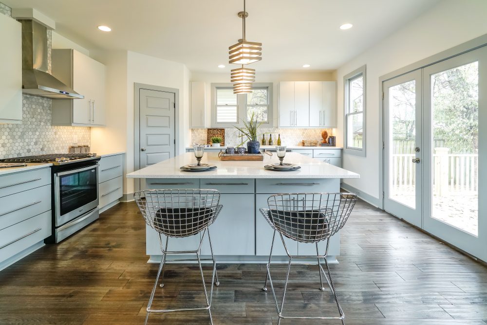 Eclectic Aesthetic Modern white kitchen with eclectic additions.