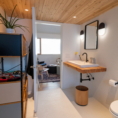 A spa-like stone and wooden bathroom