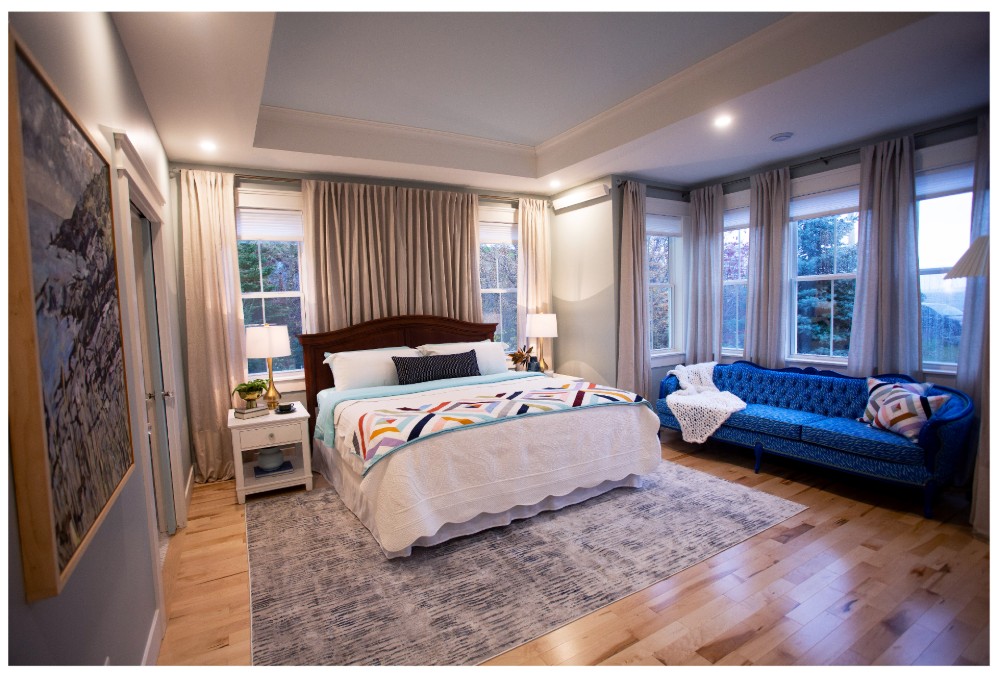 Master bedroom with traditional quilt on bed