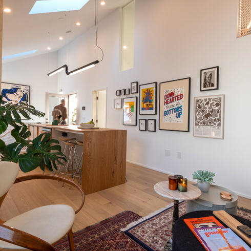 A shot of a hallway with framed prints