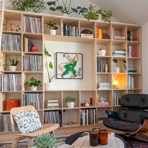 A shot of a built-in bookshelf in a modern and airy living room