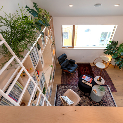 A shot from the loft space to the open living room below