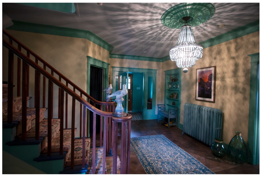 Foyer with beaded chandelier