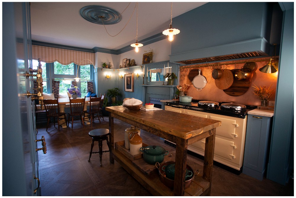 Updated blue kitchen with antique stove