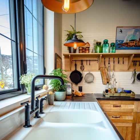 Kitchen with open shelving and hooks