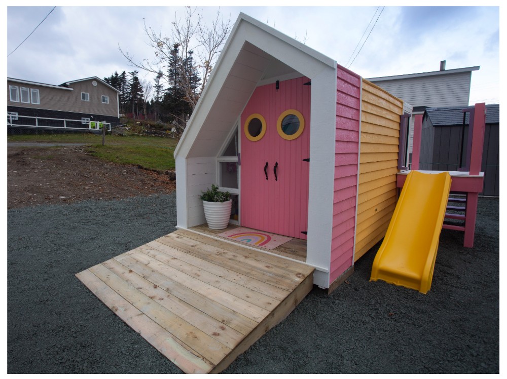 Allie's pink and yellow playhouse fully built