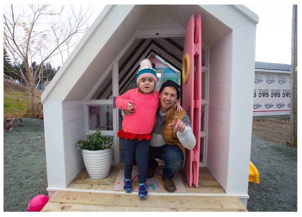 Randy Spracklin and Allie in the playhouse