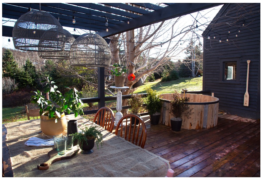 Barrel hot tub on a deck under a pergola