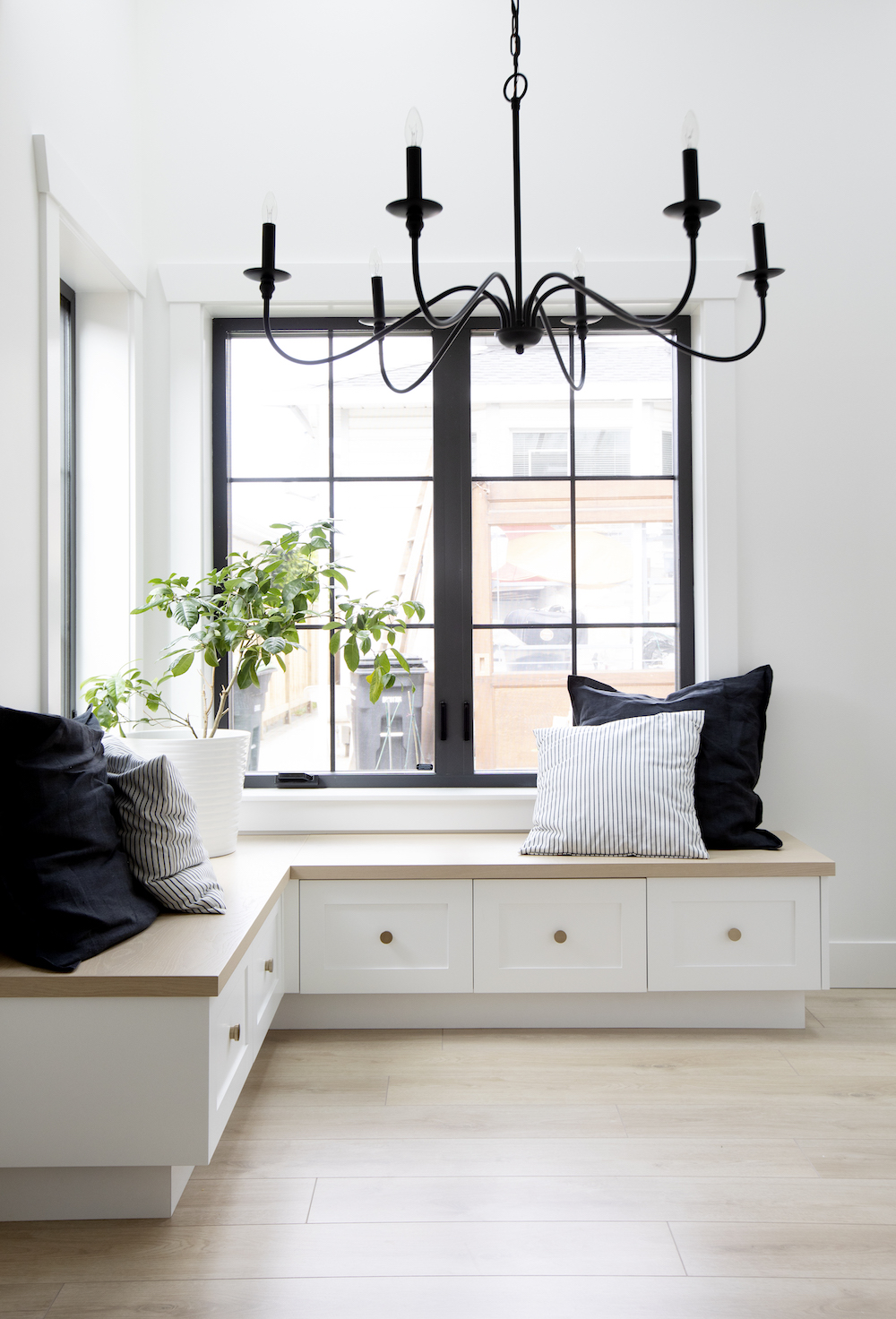 Built-in bench seating in minimalistic laneway house