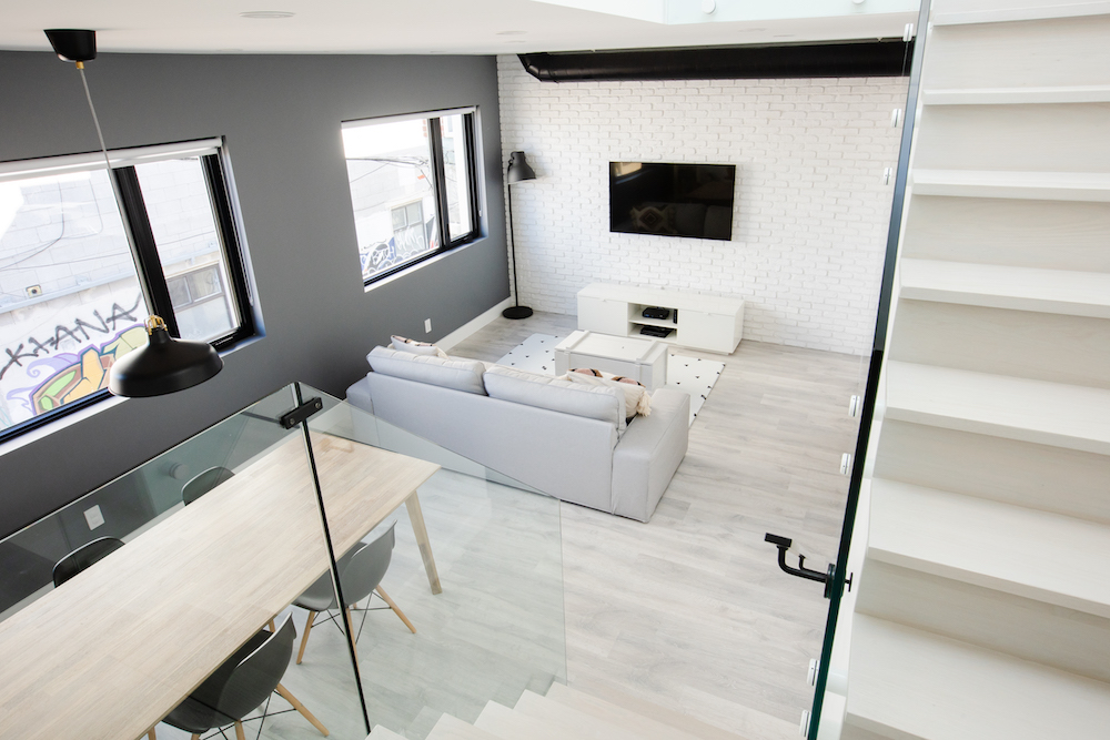 Laneway house in Toronto with white-painted brick wall living room