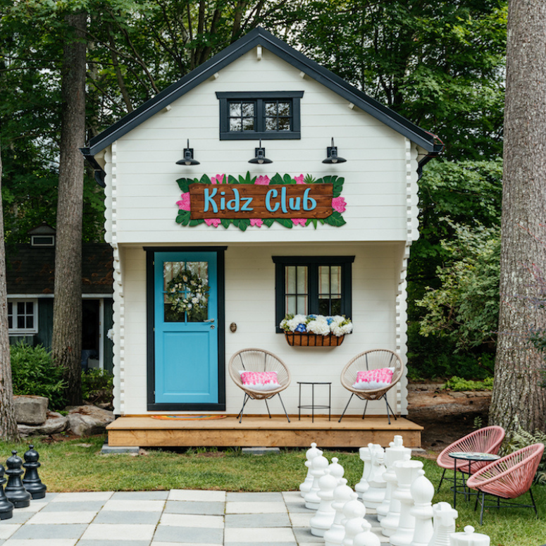 Playhouse with giant chess board and outdoor seating area