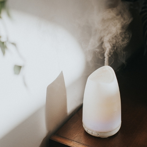 A white Oil Diffuser / Humidifier in a Domestic Setting