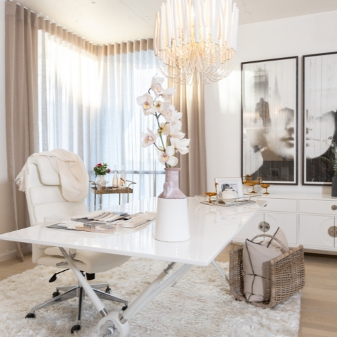 White home office with white desk chair and a white desk