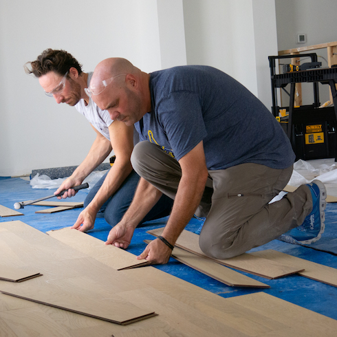 Bryan Baeumler laying office floor