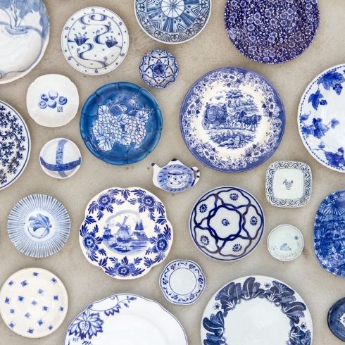 A collection of blue and white plates