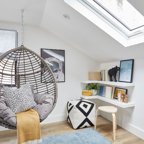 Swing chair in corner of loft space