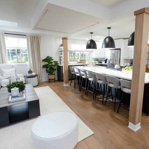 Open kitchen and living room with exposed support beams