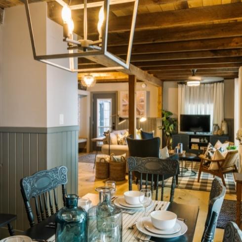 Dining room with circular table, chairs and a pendant light