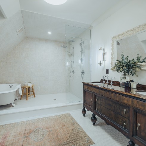 Primary bathroom with repurposed dresser vanity