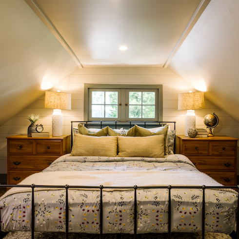 Cozy cottage pimary bedroom with yellow accents