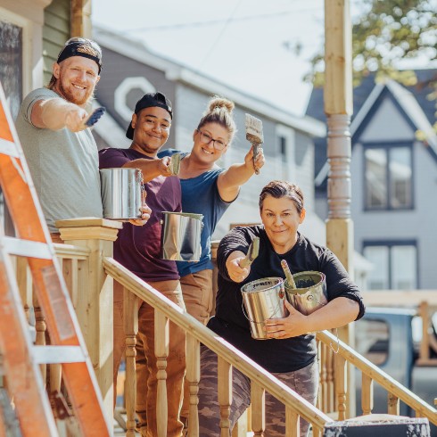 Mandy and apprentices on porch of Queen on King