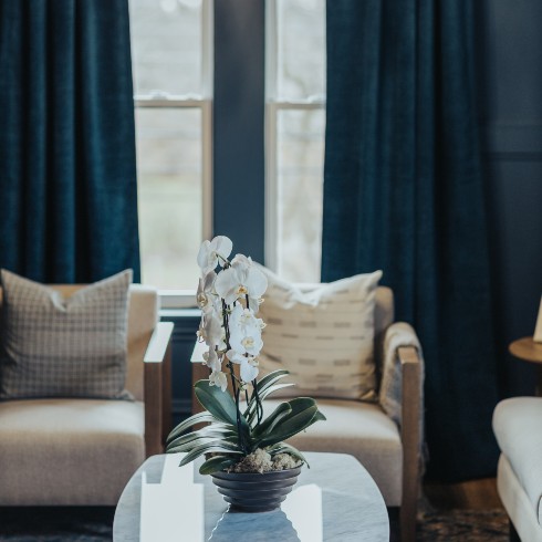 Living room with dramatic blue drapes