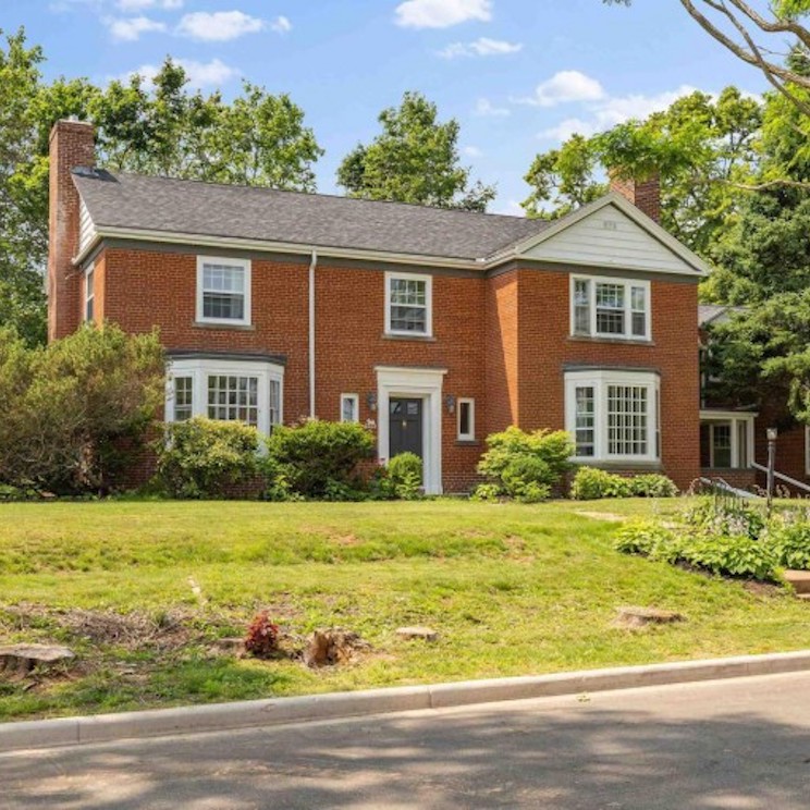 Exterior of large detached home with brown brick in Charlottetown