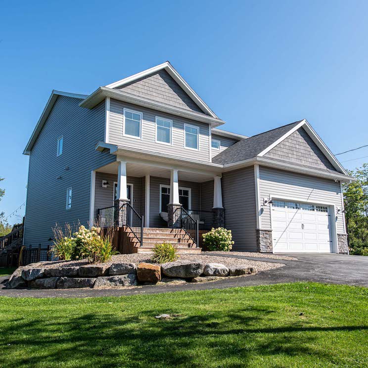 Exterior detached home with grey brick in Halifax