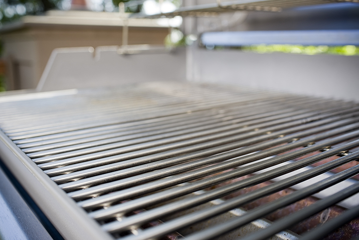 A clean silver grate of the a grill.