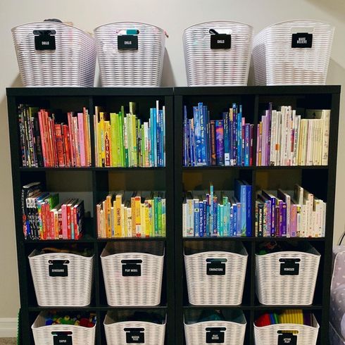 Tidy bookshelf showcasing baskets and colour-coded books