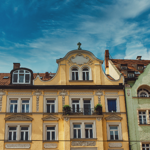 The yellow facade of a building in the Art Nouveau style