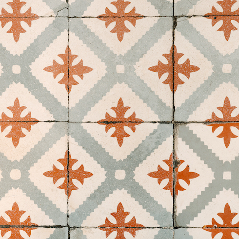 Top view of a beautiful antique decorative tile floor ornamented with orange and gray color as part of a home reno trends story for Home Network