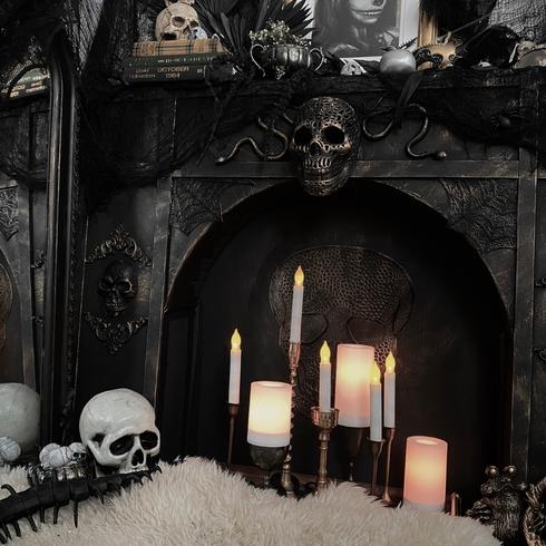 Gothic fireplace with candles and skulls