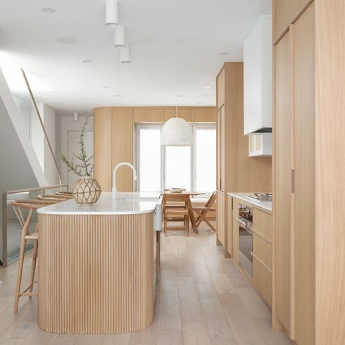 Reeded wood island in pale kitchen