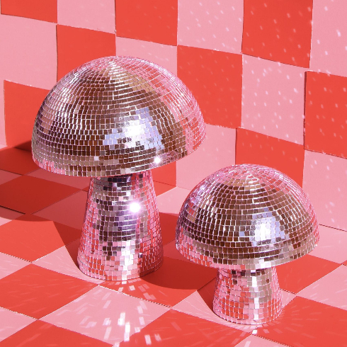 Disco ball mushrooms on a light pink and red checkboard background