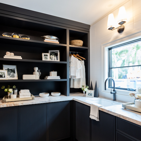 Dark laundry room with storage