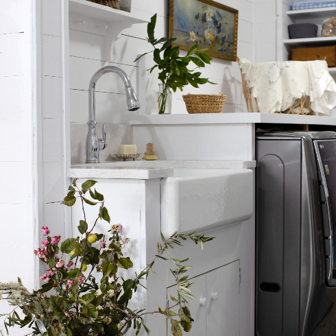 A shot of the large white laundry sink in Pamela Anderson's renovated laundry room