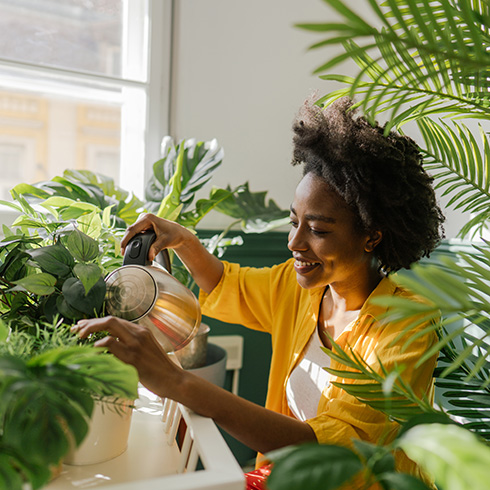 person surrounded by plants