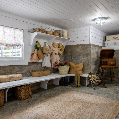 A wide shot of the mudroom zone in Pamela Anderson's renovated basement