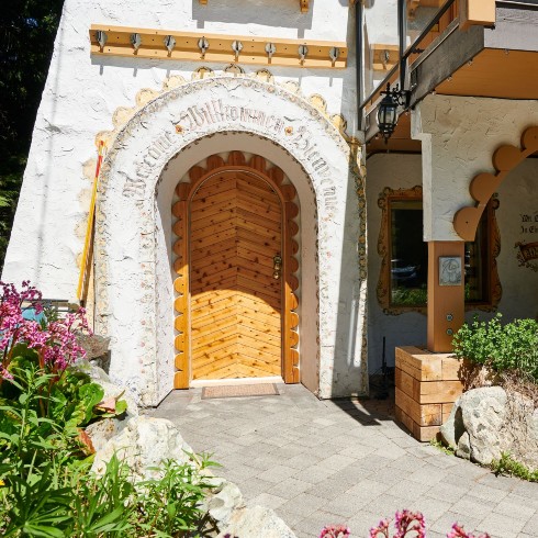 Dated door with scalloped trim