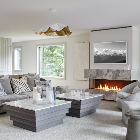 Formal living room with stone fireplace