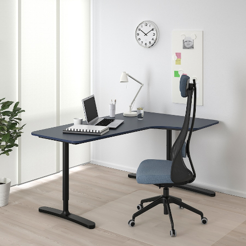 The BEKANT corner desk in a black linoleum