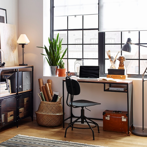 A black metal and wooden laptop table in a chic industrial office